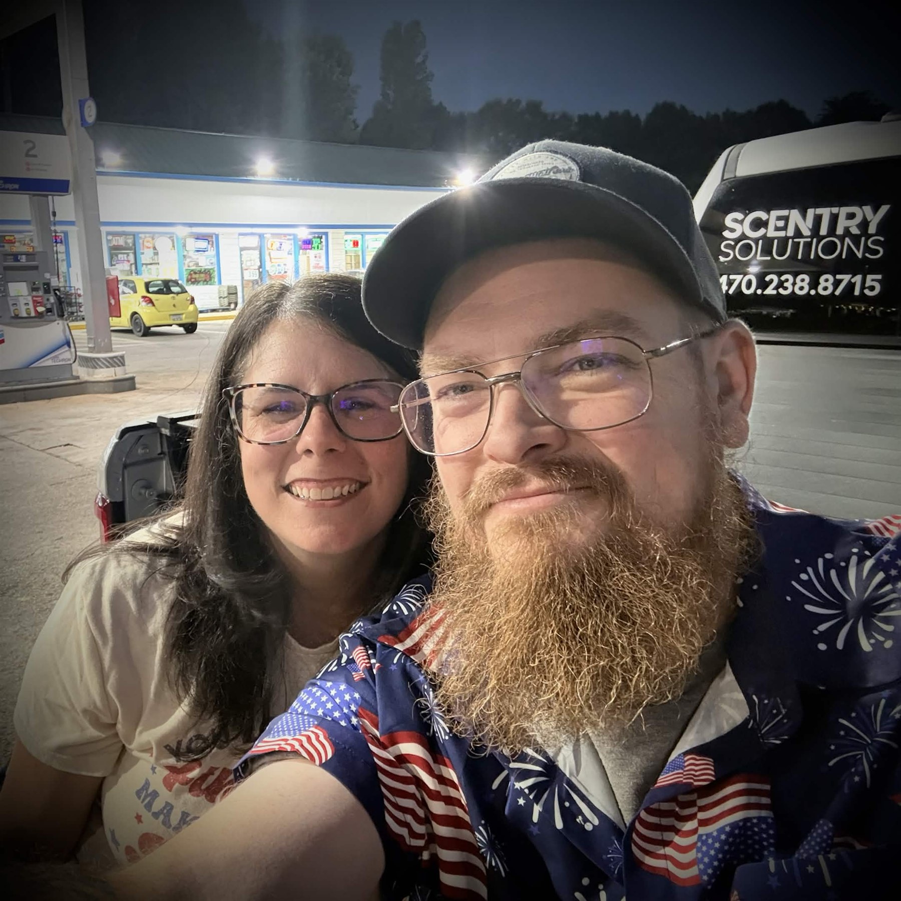 Josh with his wife beside the Scentry Solutions work vehicle